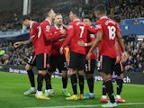 Manchester United players celebrate Cristiano Ronaldo's goal against Everton on October 9, 2022