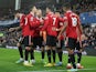 Manchester United players celebrate Cristiano Ronaldo's goal against Everton on October 9, 2022