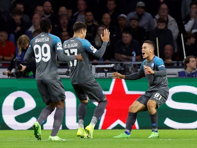 Napoli hit Ajax for six to stay top of Group A