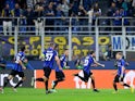 Inter Milan's Hakan Calhanoglu celebrates scoring their first goal with Lautaro Martinez and Nicolo Barella on October 4, 2022