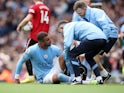 Manchester City's Kyle Walker receives medical attention on October 2, 2022