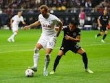 Tottenham Hotspur's Harry Kane in action with Eintracht Frankfurt's Makoto Hasebe on October 4, 2022