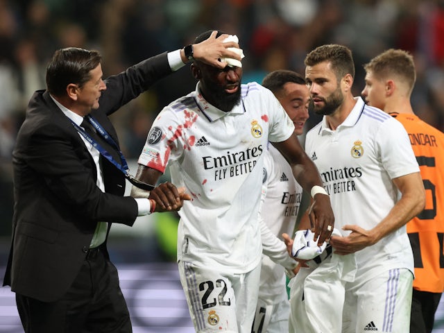 Real Madrid's Antonio Rudiger receives medical attention after scoring the equaliser on October 11, 2022