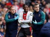 Southampton's Armel Bella-Kotchap walks off the pitch after receiving medical attention on October 16, 2022