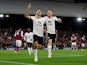 Fulham's Aleksandar Mitrovic celebrates scoring their second goal with Fulham's Harrison Reed on October 20, 2022