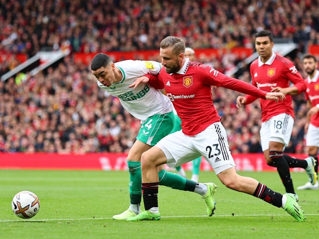 Manchester United's Luke Shaw in action with Newcastle United's Miguel Almiron on October 16, 2022