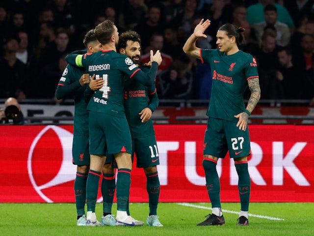 Liverpool players celebrate Mohamed Salah's goal against Ajax on October 26, 2022