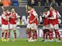 Arsenal's Martin Odegaard celebrates scoring their first goal with Fabio Vieira and William Saliba on November 12, 2022