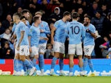 Manchester City's Riyad Mahrez celebrates scoring their first goal with teammates on November 9, 2022