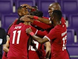 Qatar's Hasan Al Haydos celebrates scoring their second goal with teammates in September 2022