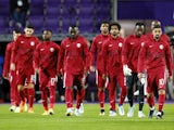 Qatar players look dejected in September 2022