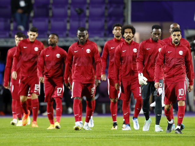 Qatar players look dejected in September 2022