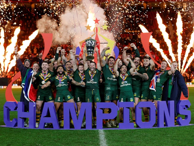 Australia's James Tedesco holds aloft the trophy as they celebrate winning the Men's World Cup Final on November 19, 2022