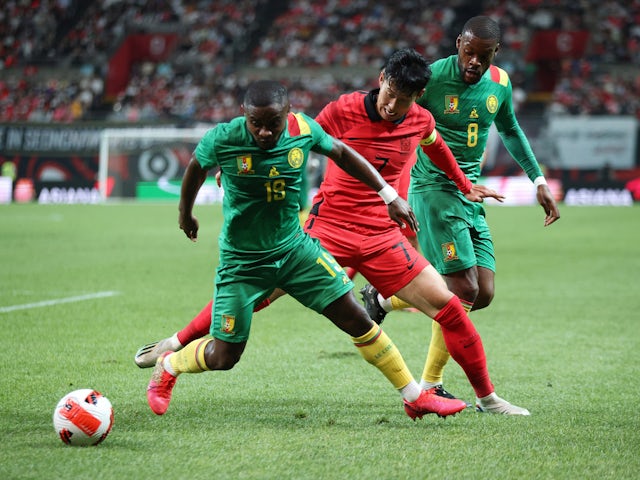 South Korea's Son Heung-min in action with Cameroon's Collins Fai and Olivier Ntcham in September 2022