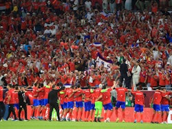 Costa Rica players celebrate with fans after qualifying for the Qatar 2022 FIFA World Cup in June 2022