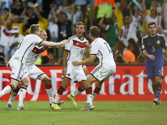 Mario Gotze (C) celebrates with team mates after scoring the first goal for Germany in the 2014 World Cup final