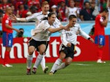 Germany's Philipp Lahm (R) celebrates his goal against Costa Rica with team mates Torsten Frings (C) and Bastian Schweinsteiger during their Group A World Cup 2006 soccer match in Munich June 9, 2006
