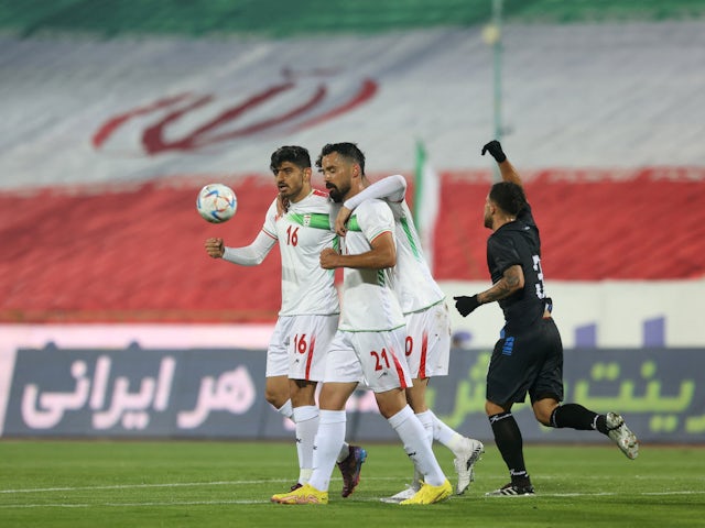 Iran's Mehdi Torabi celebrates scoring their first goal with teammates on November 10, 2022