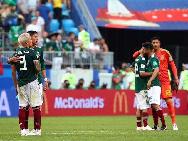 Mexico's Carlos Salcedo and Edson Alvarez react after being knocked out of the 2018 World Cup