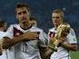 Germany's Miroslav Klose holds the World Cup trophy after the 2014 World Cup final against Argentina at the Maracana stadium in Rio de Janeiro July 13, 2014