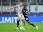 Red Bull Salzburg's Noah Okafor in action with AC Milan's Pierre Kalulu on November 2, 2022