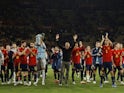 Spain coach Luis Enrique celebrates with his players as Spain qualify for the Qatar 2022 World Cup in November 2021