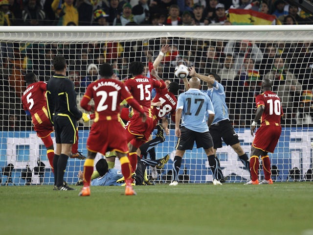 Uruguay's Luis Suarez handles the ball to concede a penalty against Ghana at the 2010 World Cup