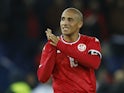 Tunisia's Wahbi Khazri applauds fans after the match in September 2022
