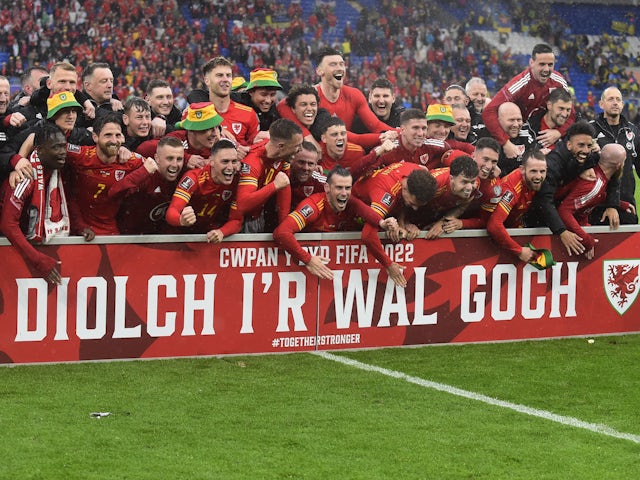 Wales players celebrate after qualifying for the World Cup in June 2022