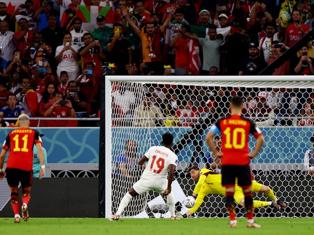 Belgium's Thibaut Courtois saves a penalty from Canada's Alphonso Davies at the World Cup on November 23, 2022.
