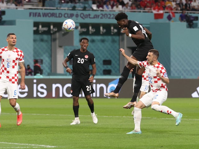 Alphonso Davies scores a header for Canada against Croatia at the World Cup on November 27, 2022.