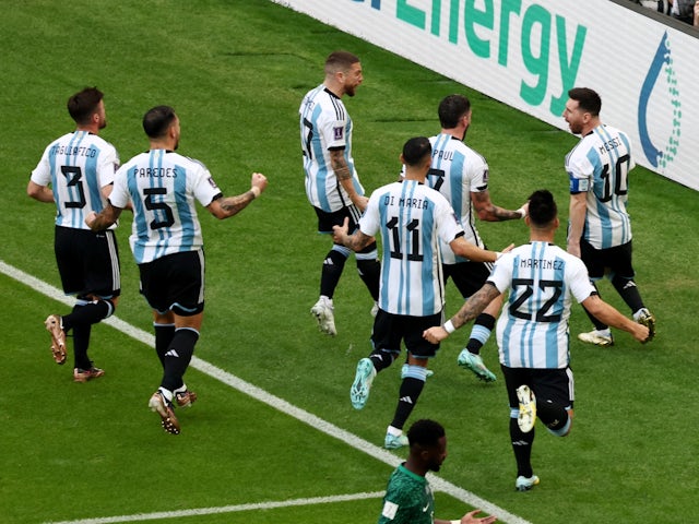 Argentina's Lionel Messi celebrates scoring their first goal with teammates on November 22, 2022