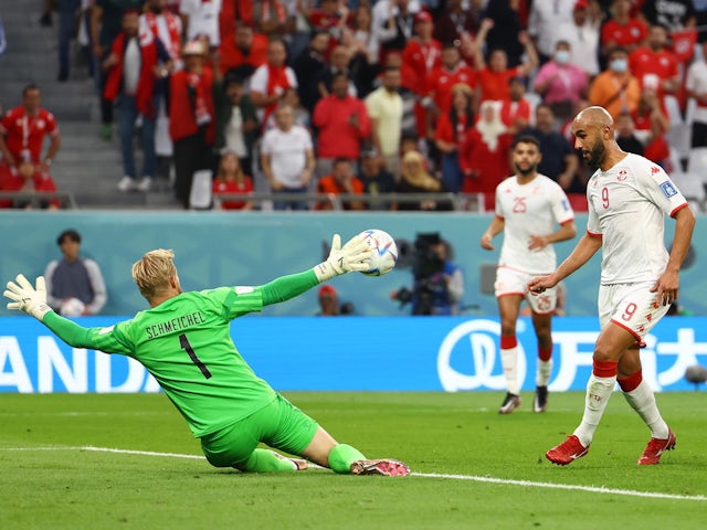 Denmark's Kasper Schmeichel in action as he saves a shot from Tunisia's Issam Jebali on November 22, 2022