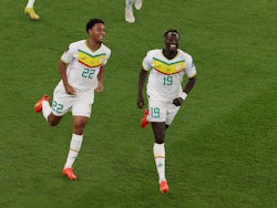 Senegal forward Famara Diedhiou celebrates scoring against Qatar in their World Cup game on November 25, 2022.