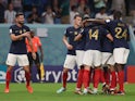 France's Olivier Giroud celebrates scoring their second goal with teammates on November 21, 2022