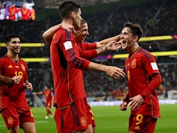 Spain's Gavi celebrates scoring their fifth goal with Dani Olmo and Alvaro Morata on November 23, 2022