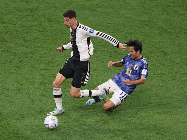 Germany's Kai Havertz in action with Japan's Takefusa Kubo at the World Cup on November 23, 2022