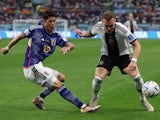 Japan's Hiroki Sakai in action with Germany's David Raum at the World Cup on November 23, 2022