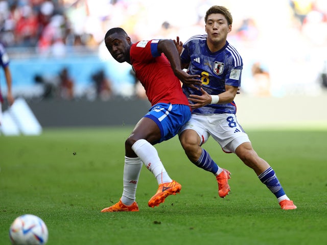 Costa Rica's Joel Campbell in action with Japan's Ritsu Doan at the World Cup on November 27, 2022