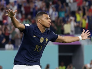 Mbappe double sends France into World Cup last 16