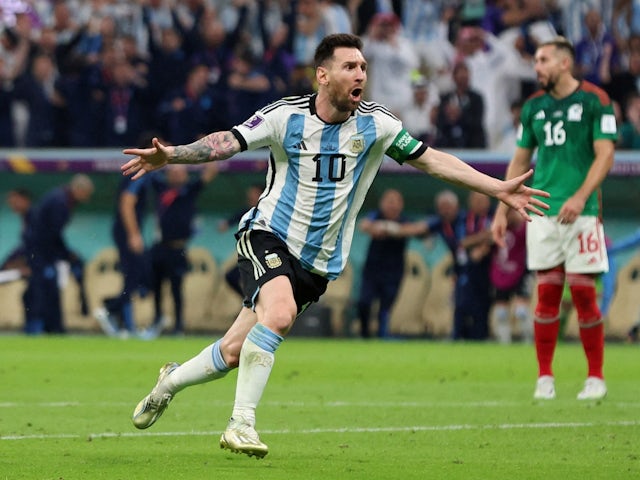 Argentina's Lionel Messi celebrates scoring their first goal on November 26, 2022