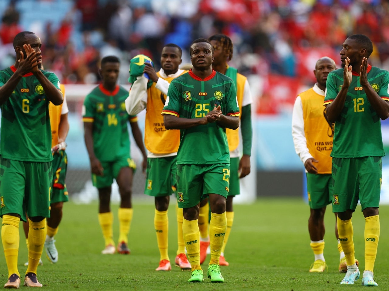 Cameroon's Nouhou Tolo, Nicolas Moumi Ngamaleu and Karl Toko Ekambi look dejected after the match on November 24, 2022