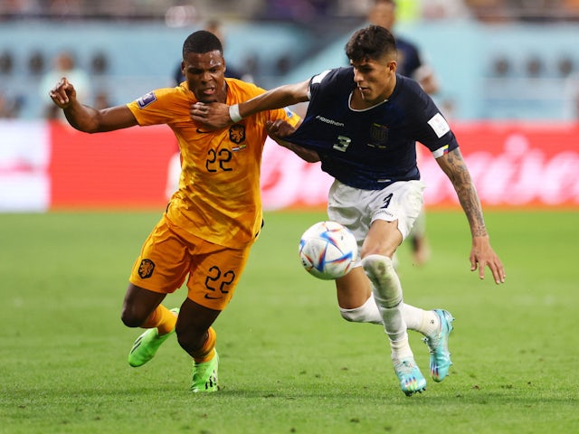 Netherlands' Denzel Dumfries and Ecuador's Piero Hincapie in action at the World Cup on November 25, 2022.