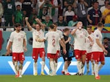 Poland's Robert Lewandowski celebrates scoring their second goal with teammates on November 26, 2022