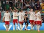 Poland's Robert Lewandowski celebrates scoring their second goal with teammates on November 26, 2022
