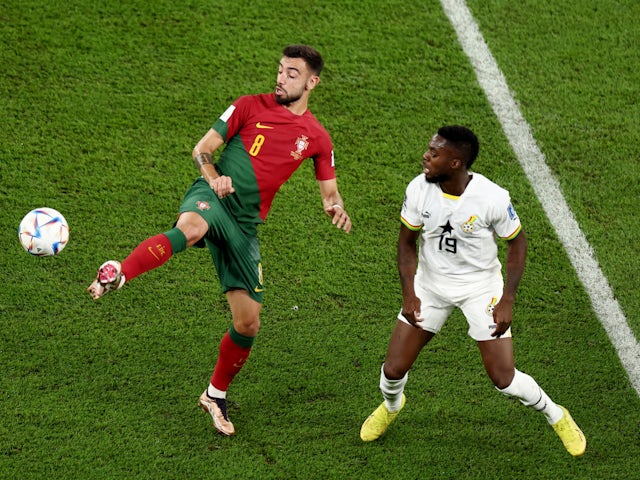 Portugal's Bruno Fernandes in action with Ghana's Inaki Williams at the World Cup on November 24, 2022