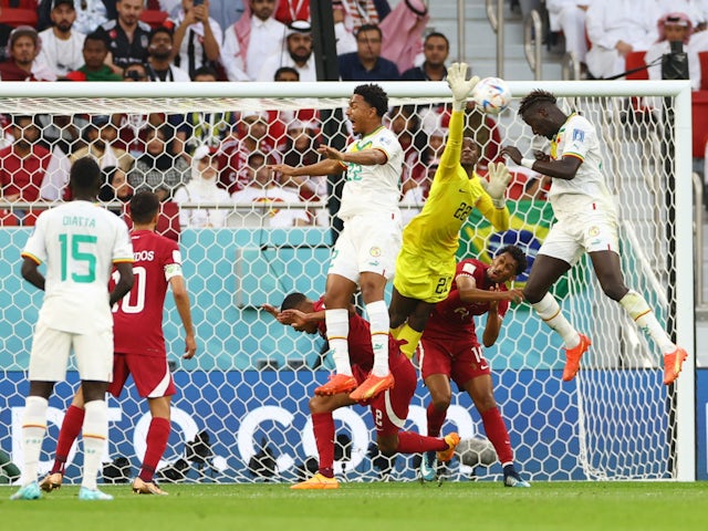 Senegal defender Krepin Diatta misses a chance against Qatar in their World Cup game on November 25, 2022.