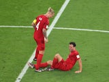 Denmark's Thomas Delaney reacts after sustaining an injury as Simon Kjaer looks on pictured on November 22, 2022