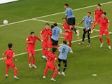 Uruguay's Diego Godin heads at goal in the World Cup clash with South Korea on November 24, 2022