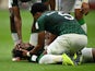 Saudi Arabia's Yasser Al-Shahrani after sustaining an injury as Ali Al Bulayhi looks on, on November 22, 2022